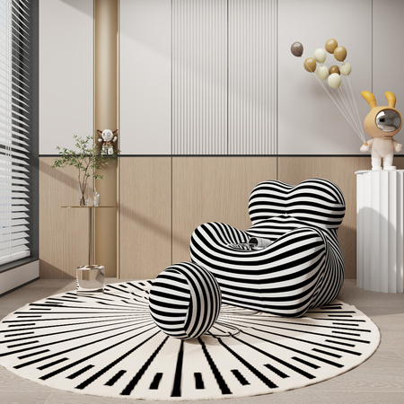 Wypoczynkowy fotel z podnóżkiem w czarno białe paski