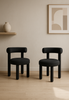 Leith – Czarny fotel tapicerowany z tkaniny boucle w stylu nowoczesnym