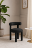Leith – Czarny fotel tapicerowany z tkaniny boucle w stylu nowoczesnym